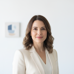 Portrait of Elena Rodriguez, a North American woman with a professional and warm expression, smiling softly against a clean w