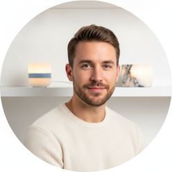Portrait of Jordan Vance, a North American man, smiling with a professional and approachable expression against a clean brigh