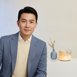 Portrait of Daniel Kim, an Asian man, in a minimalist studio setting with a subtle dusty blue tint, looking confidently at th